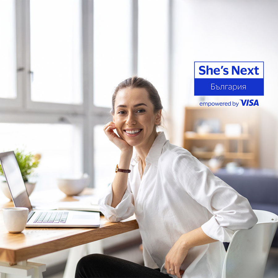 woman at desk and visa shes next logo
