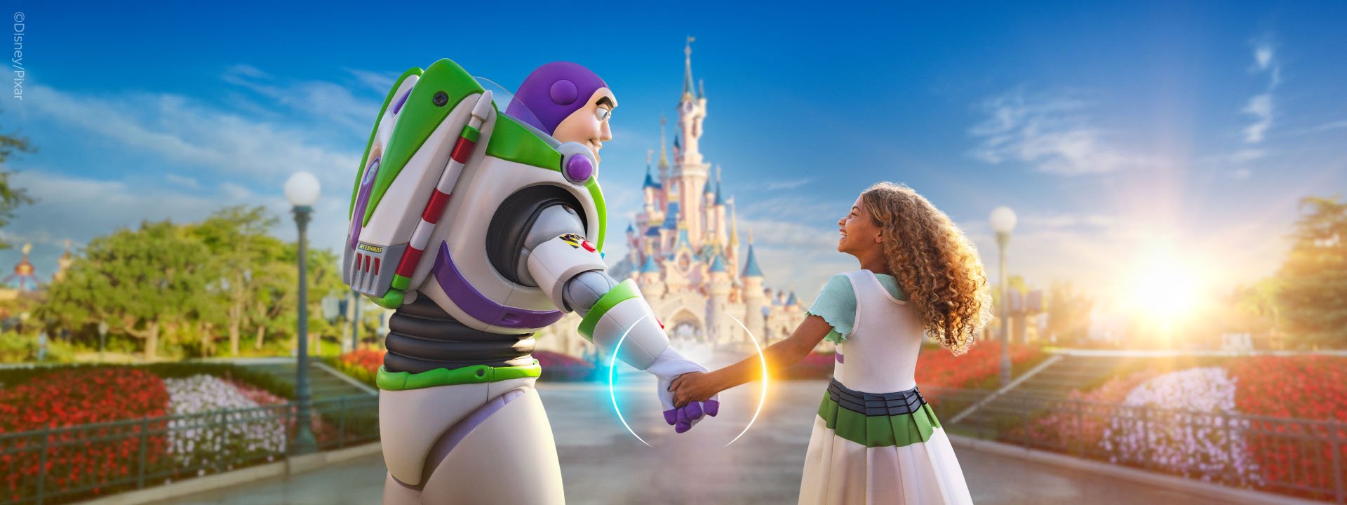Buzz lightyear and child holding hands in front of disney castle