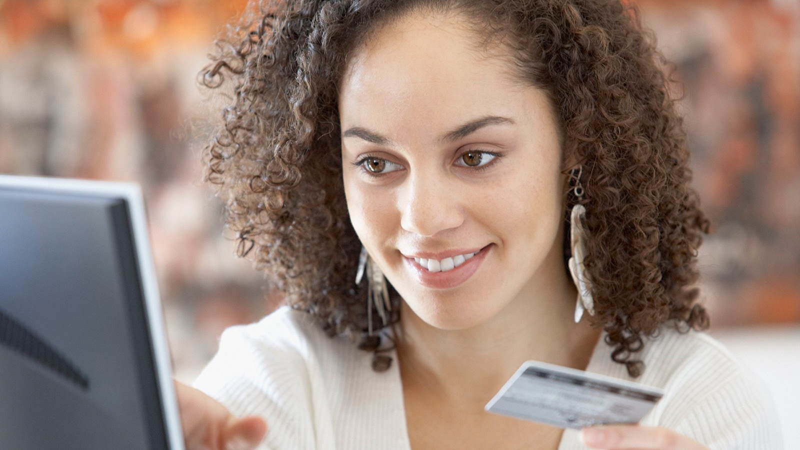 Woman paying online with card